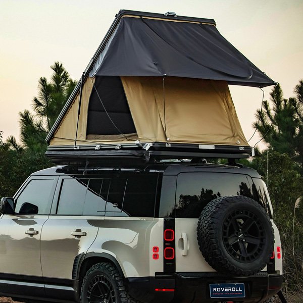 Angled side view of open Roveroll Tri-Clam Roof Top Tent