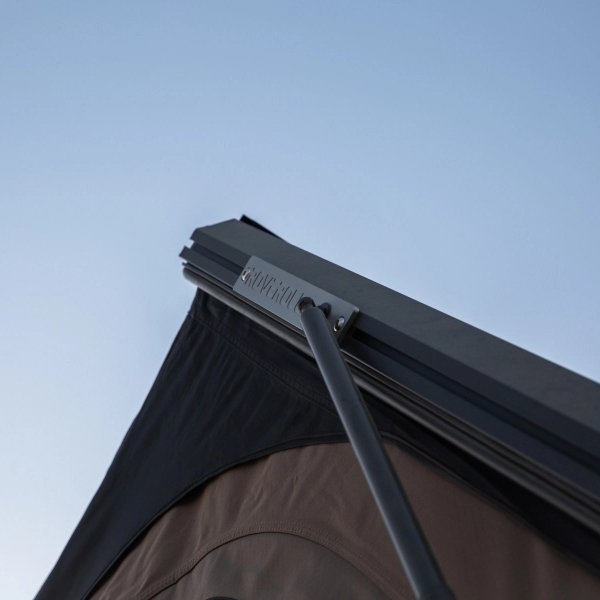 Close-up of hydraulic strut on ROVEROLL Aluminum Side Opening Hard Roof Top Tent
