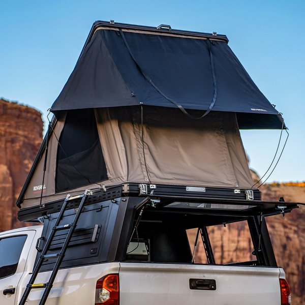 Left rear angled outdoor view of opened ROVEROLL SkyNest Tent Combo mounted on vehicle