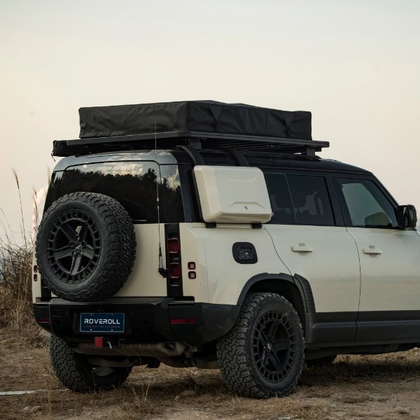 Outdoor view of unopened ROVEROLL Soft Shell Roof Top Tent mounted on vehicle