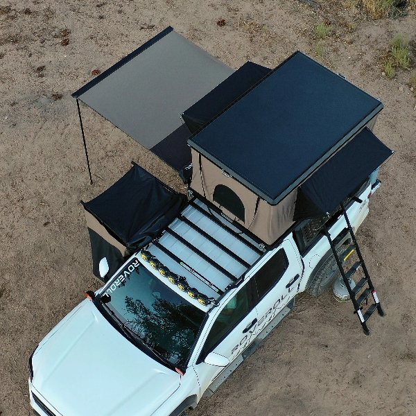 zion alumiRoveroll Pop-up Roof Top Tent Opened and secured on roof rack of white trucknum shell pop up roof top tent