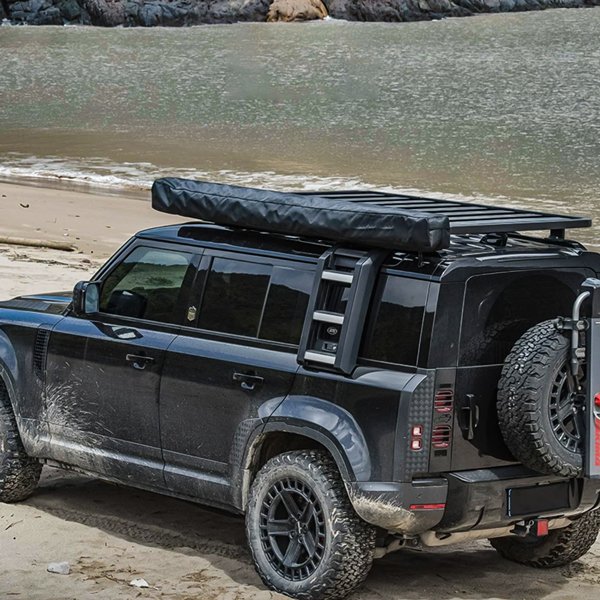 Angled side view of closed ROVEROLL 270-degree awning mounted on vehicle