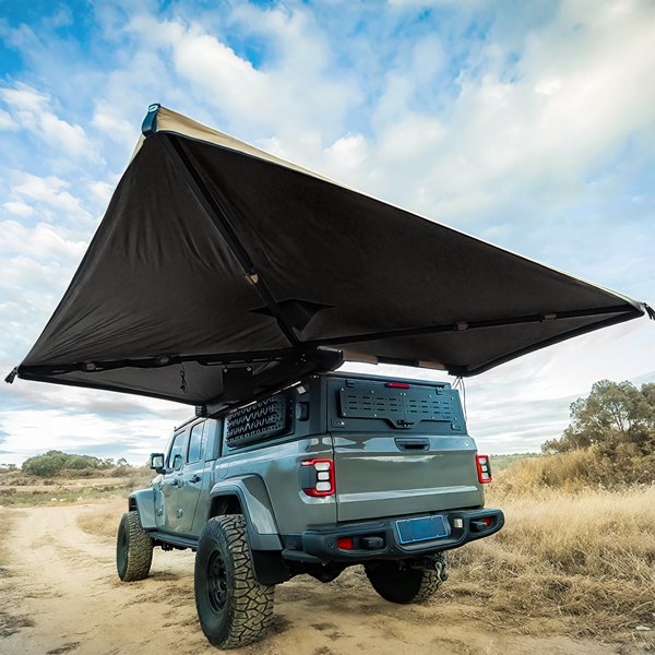 Angled upward view of ROVEROLL 270-degree awning mounted on vehicle