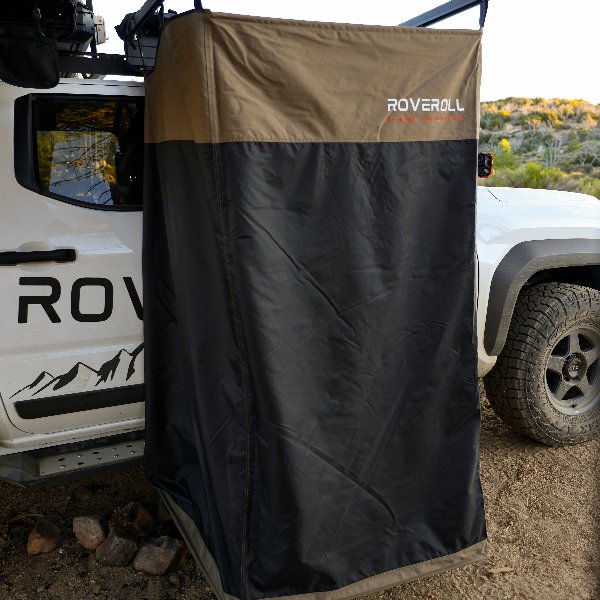 Close-up of ROVEROLL Shower Tent in open position mounted on vehicle