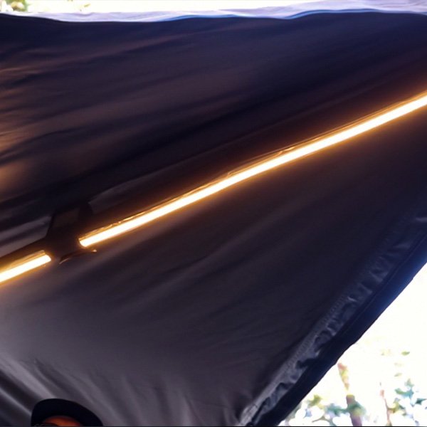 Upward close-up view of LED light strip on ROVEROLL 270-degree awning