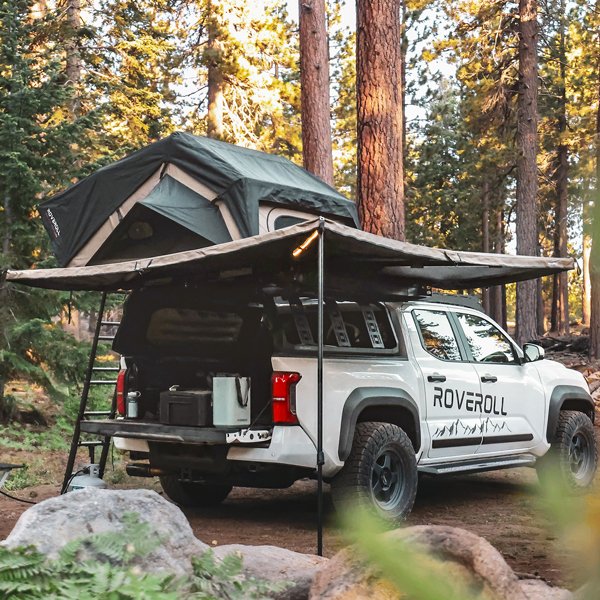 Vehicle with ROVEROLL 270-degree awning camping in the forest