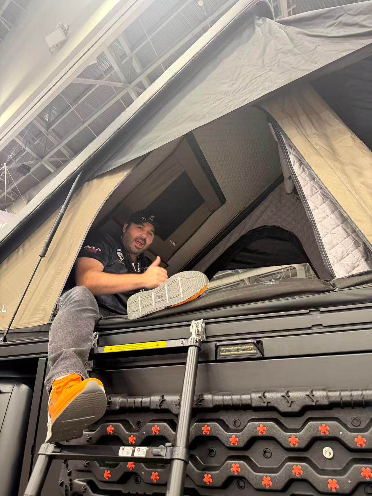 Real customer inspecting a Roveroll roof top tent